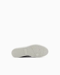 Sneakers with allover logo inserts