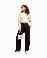 Pleated trousers with allover logo