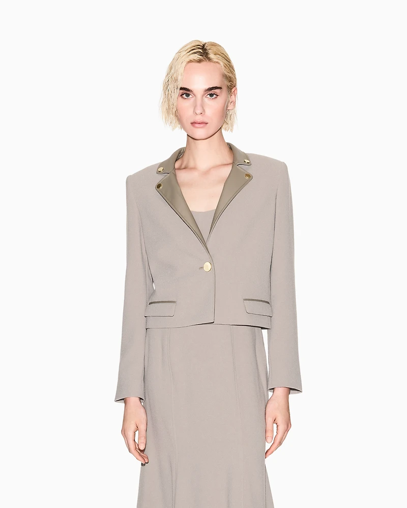 Short jacket with metal details