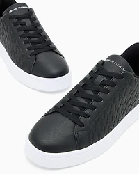 Lace-up sneakers with allover embossed logo