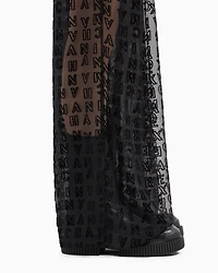 Sheer wide leg trousers with allover logo