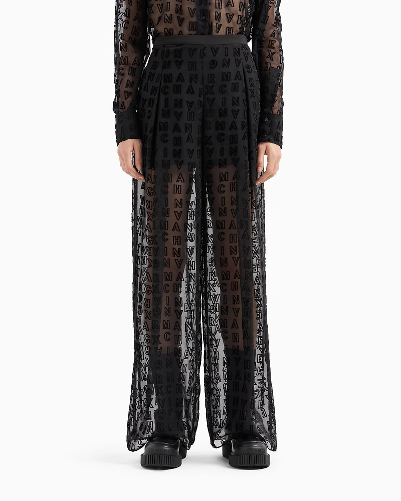 Sheer wide leg trousers with allover logo