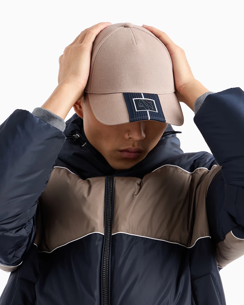 Cap with visor and logo patch