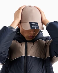 Cap with visor and logo patch