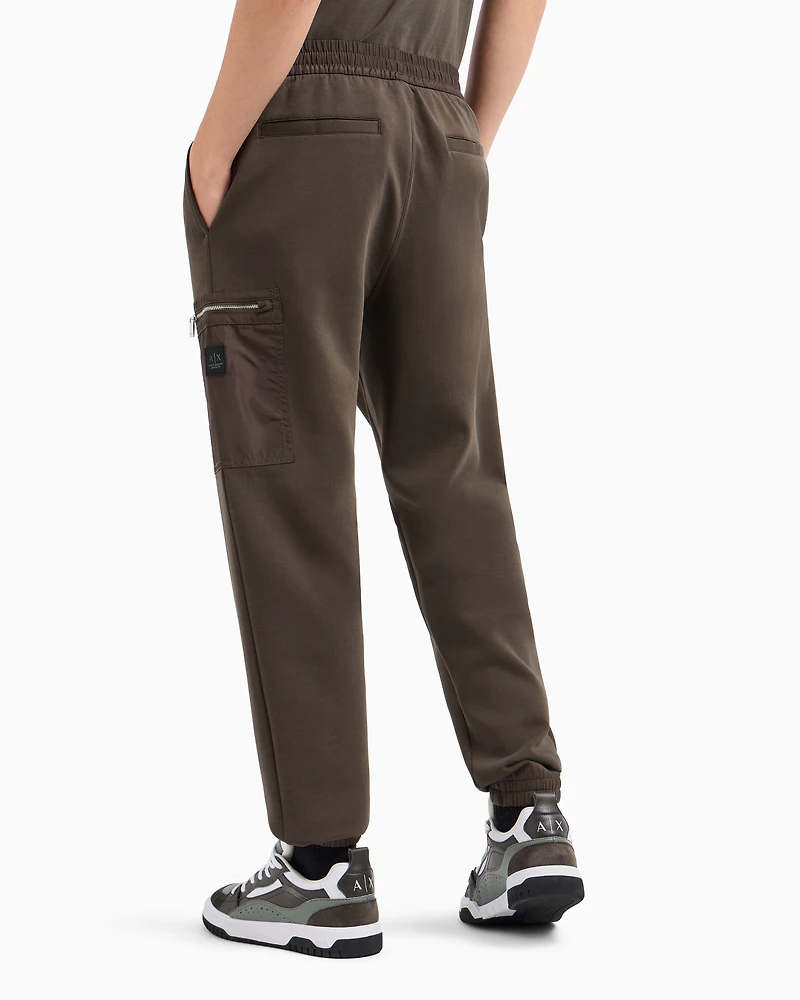 Oversized trousers with zip pocket