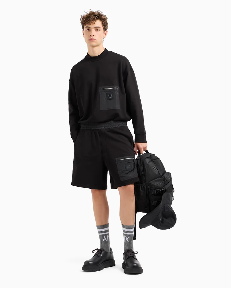 Crewneck sweatshirt with zip-up pocket