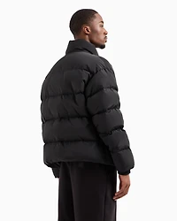 Padded and quilted jacket with high collar