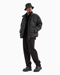 Padded and quilted jacket with high collar