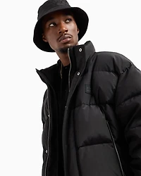 Padded and quilted jacket with high collar
