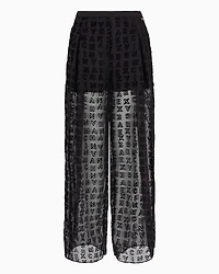 Sheer wide leg trousers with allover logo