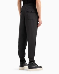 Trousers with pleats and pockets on the back