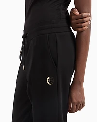 Jogger pants with metal logo