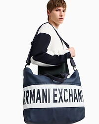 Duffel bag with maxi-logo and shoulder strap