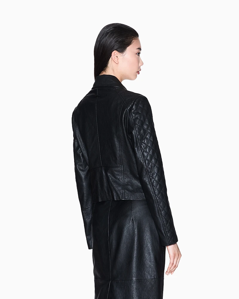 Leather jacket with quilted sleeves