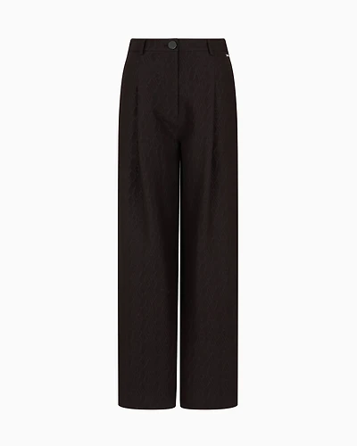 Pleated trousers with allover logo