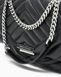 Shoulder bag in quilted material with metal details