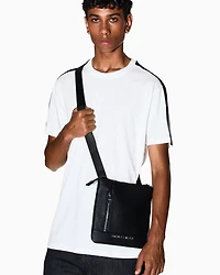 Flat crossbody bag with external pocket