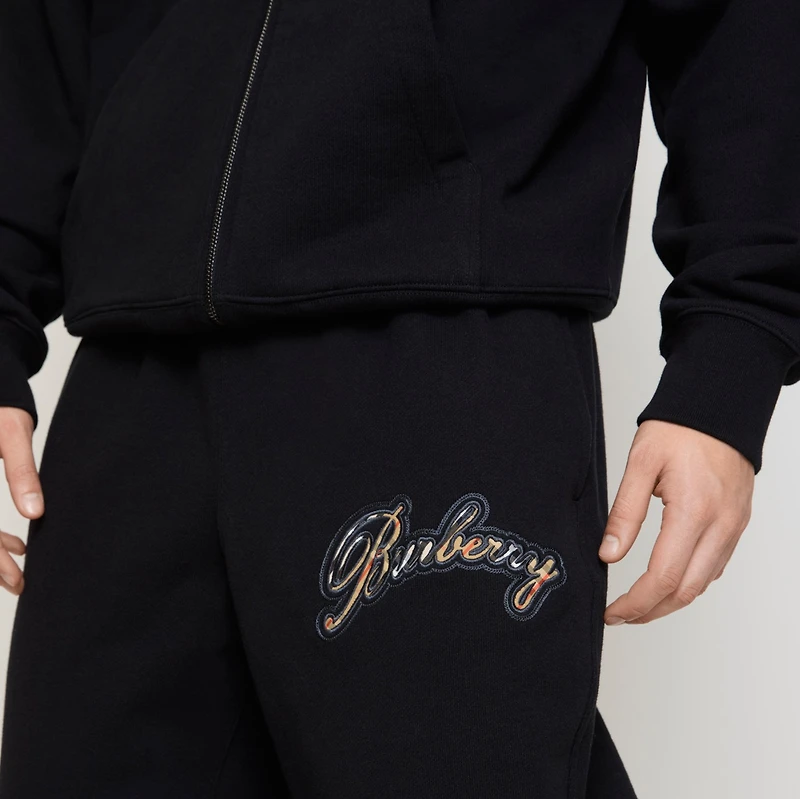 Check Cursive Logo Cotton Jogging Pants in Black - Men | Burberry® Official