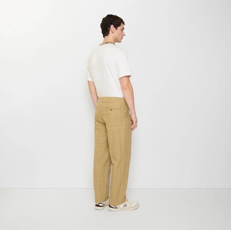 Textured Check Cotton Trousers in Sandstorm beige - Men | Burberry® Official