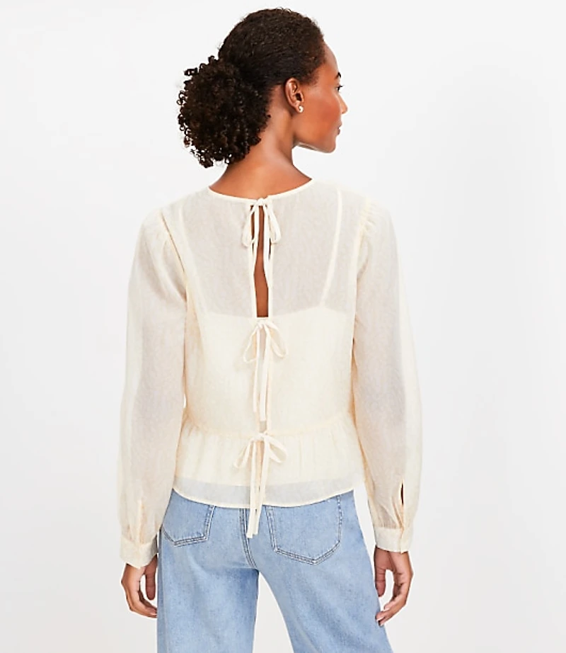 Feather Print Tie Back Peplum Blouse