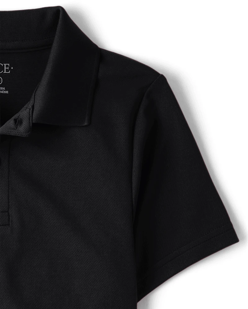 Polo de performance uniforme pour garçon