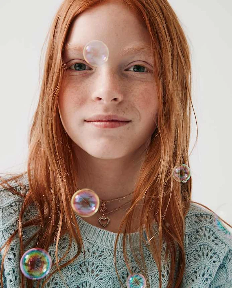 Pull en pointelle festonné pour fille