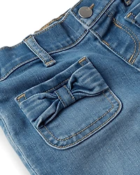 Jean large à nœud pour petite fille