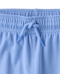 Short de sport enfant à séchage rapide et bandes latérales en maille