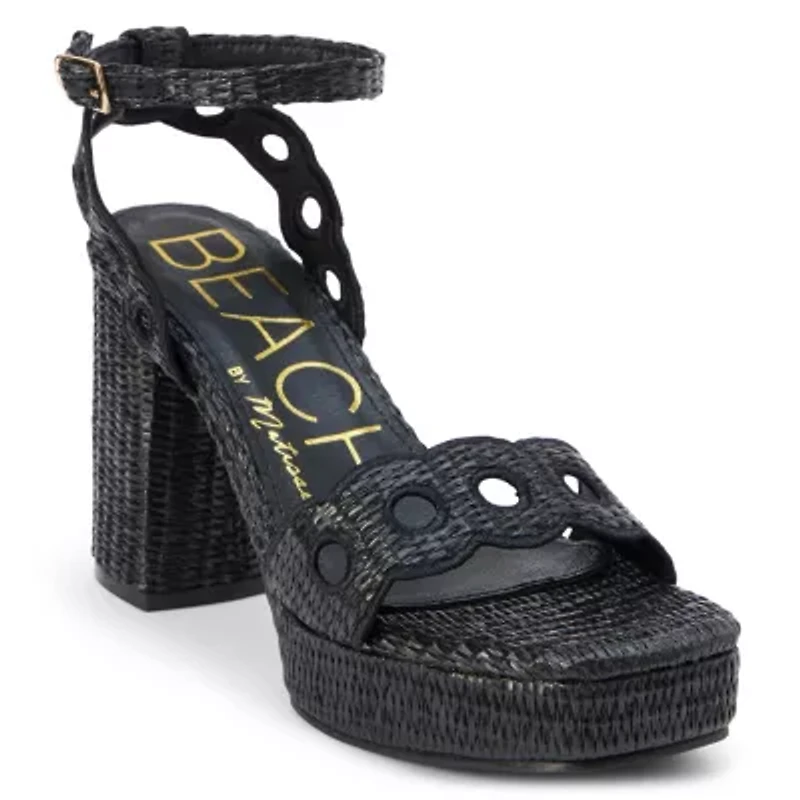 Vegan, platform heeled sandal with scallop and cut-out detail.