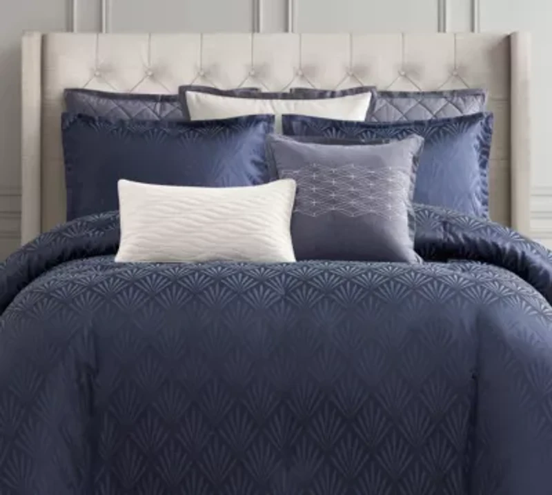 Enhance the elegance of your bedroom with the Waterford Chloe Navy Euro Sham. This beautifully crafted euro sham is designed to perfectly complement the Chloe Navy Comforter Set, offering a deep navy tone that adds a rich, luxurious feel to your bedding. Featuring the same intricate pattern in the comforter, the euro sham creates an elevated, cohesive look while adding depth and texture. An ideal addition for layering on your bed. The Chloe Navy Euro Sham is the perfect finishing touch, bringing a sophisticated and inviting atmosphere to your bedroom.