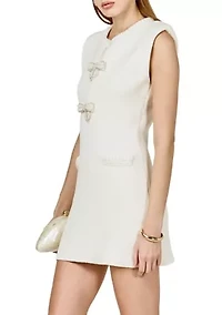Sleeveless mini knit dress with bow accents