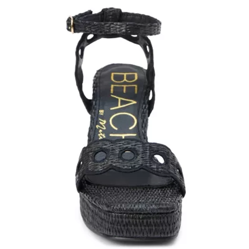 Vegan, platform heeled sandal with scallop and cut-out detail.