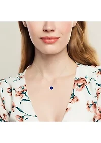 Sterling Silver Created Blue Sapphire Oval Pendant Necklace with White Topaz Sunburst Halo 9mm x 7mm 18 Inch Cable Chain