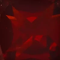 7 Millimeter Cushion Cut Garnet and Diamond Accent Halo Stud Earrings in Sterling Silver