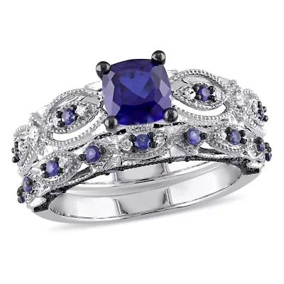 2 ct. t.g.w. Created Blue Sapphire and 1/10 t.w. Diamond Engagement Ring 10K White Gold with Black Rhodium Plated