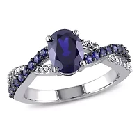 2.36 ct. t.g.w. Created Blue Sapphire and 1/10 t.w. Diamond Crossover Ring 10K White Gold Black Rhodium Plated