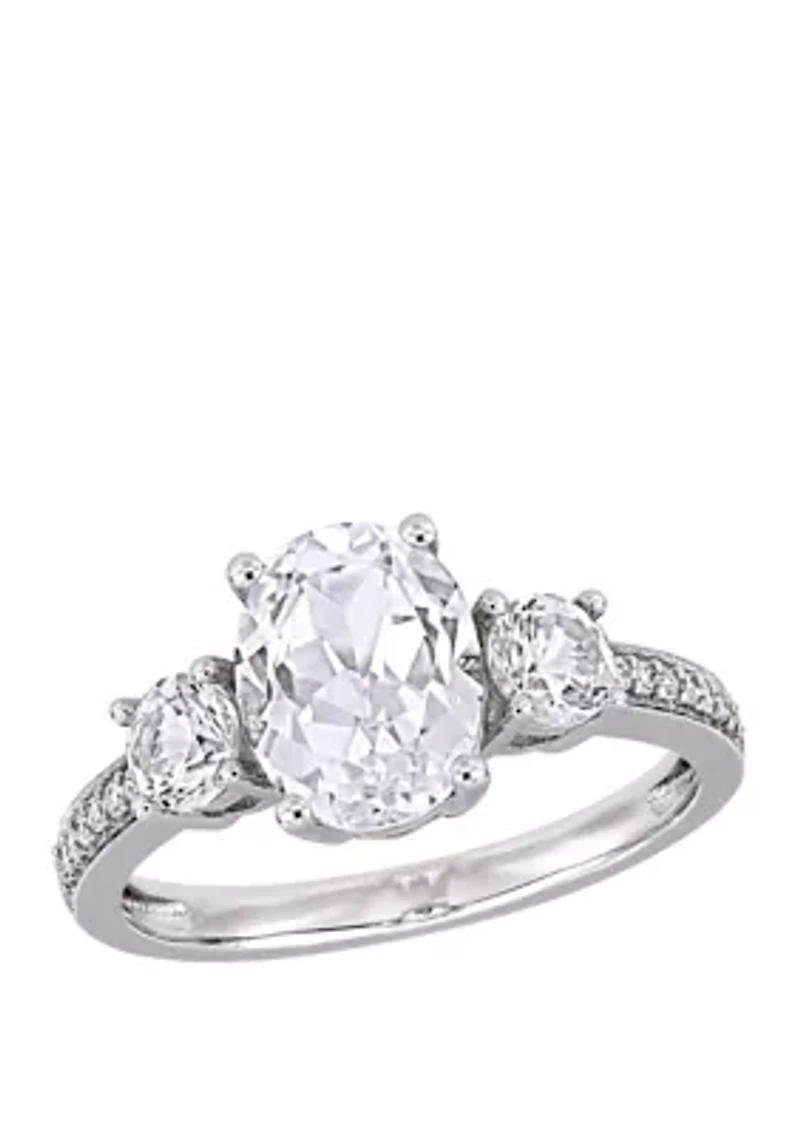 3.3 ct. t.w. Lab Created White Sapphire and 1/10 Diamond Oval 3 Stone Ring 10K Gold