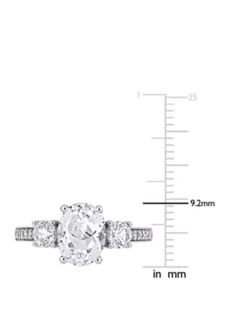 3.3 ct. t.w. Lab Created White Sapphire and 1/10 Diamond Oval 3 Stone Ring 10K Gold