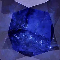 3/4 ct. t.w. Diffused Sapphire and 1/10 ct. t.w. Diamond Halo Pendant with Chain in 10k White Gold