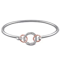 1/10 ct. t.w. Diamond Interlocking Circle Bangle in Sterling Silver
