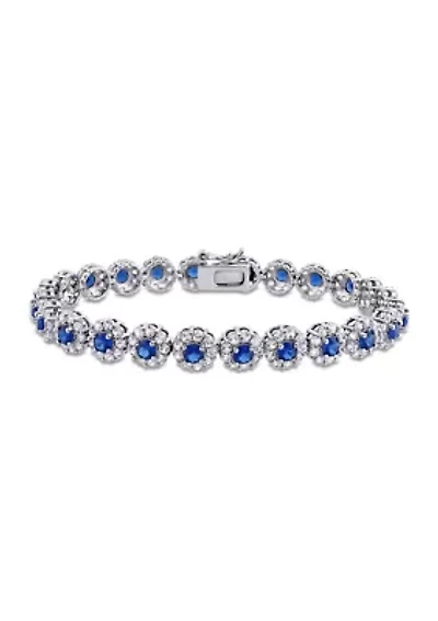 Lab Created 11.28 ct. t.g.w. Created Blue and White Sapphire Halo Tennis Bracelet in Sterling Silver