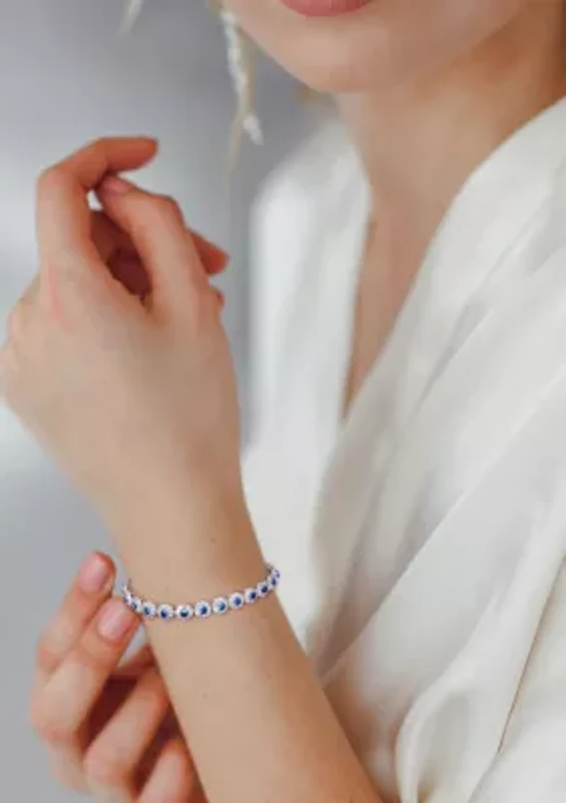 Lab Created 11.28 ct. t.g.w. Created Blue and White Sapphire Halo Tennis Bracelet in Sterling Silver