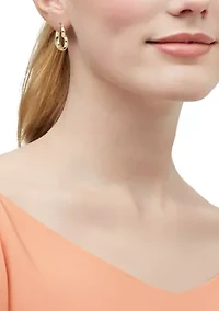 Graduated Heart Hoop Earrings in Gold Over Silver