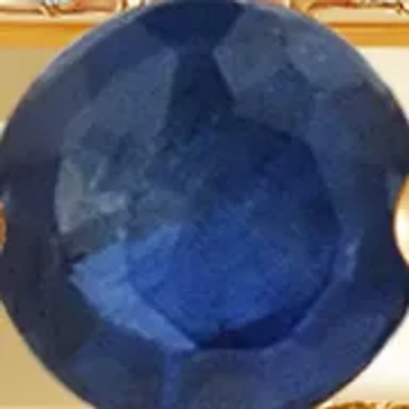 Sapphire and 1/10 ct. t.w. Diamond Band Ring in 10K Yellow Gold