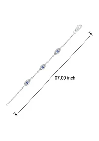 1/5 ct. t.w. Diamond and 1/8 ct. t.w. Created Blue Sapphire Evil Eye Bracelet in Sterling Silver