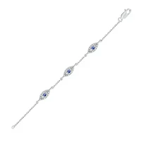 1/5 ct. t.w. Diamond and 1/8 ct. t.w. Created Blue Sapphire Evil Eye Bracelet in Sterling Silver