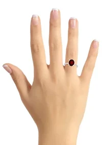 Sterling Silver 10x8mm Oval Garnet 1/10 CTTW Diamond Ring