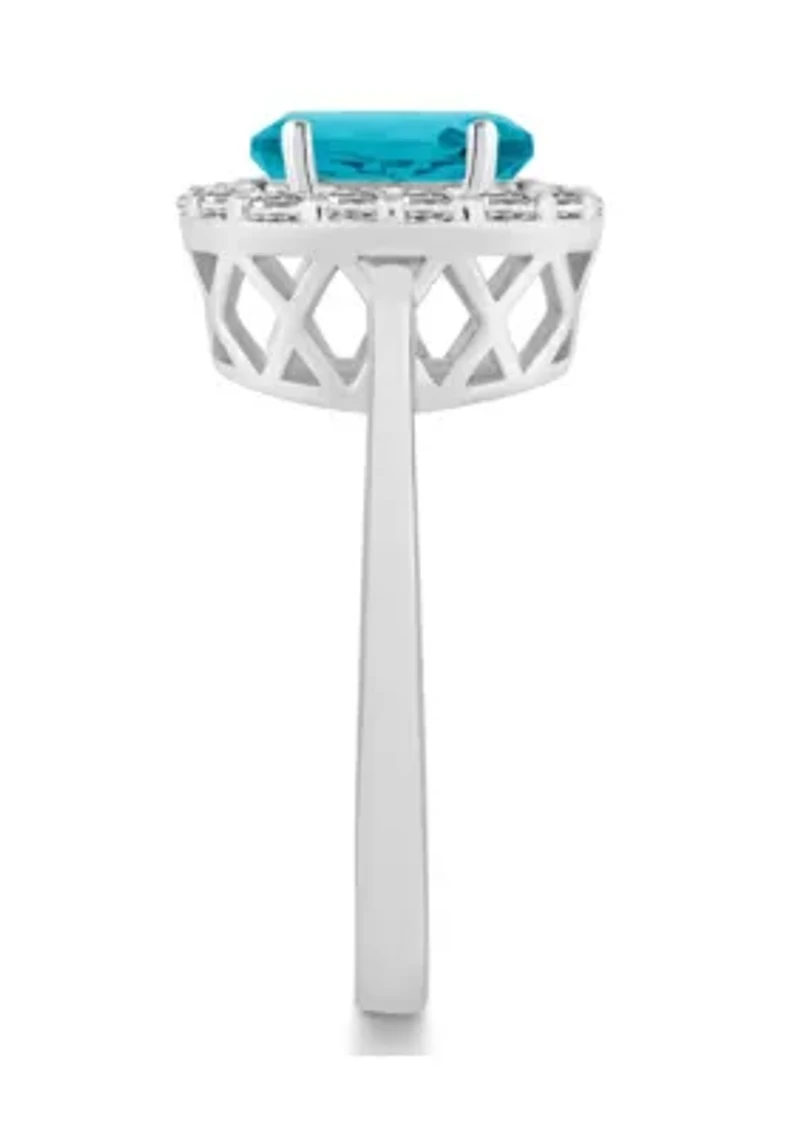 Sterling Silver 8x6mm Oval Blue Topaz And White Halo Ring