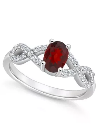 Sterling Silver 7x5mm Oval Garnet and White Topaz Accent Ring