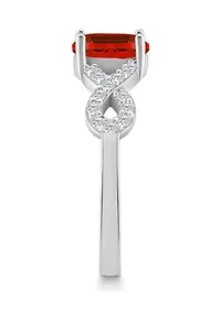 Sterling Silver 7x5mm Oval Garnet and White Topaz Accent Ring